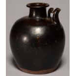 A CHINESE POTTERY EWER, IN TANG DYNASTY (HENAN) STYLE, OVOID, THE SLIGHTLY TAPERED CYLINDRICAL