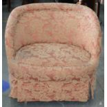 A VICTORIAN TUB CHAIR ON EBONISED LEGS WITH BRASS CASTORS, UPHOLSTERED IN BUTTONED CORAL FABRIC