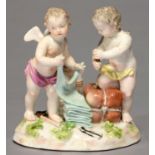A MEISSEN GROUP OF TWO PUTTI EMBLEMATIC OF TRADE, LATE 19TH C, ONE KNEELING ON A PARCEL, THE OTHER