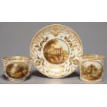 A DERBY TRIO, C1820, WITH WISHBONE HANDLES, PAINTED IN THE MANNER OF DANIEL LUCAS WITH LANDSCAPES IN