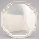 A GEORGE V SILVER SALVER, SHAPED SQUARE, ON FOUR LEAF CAPPED VOLUTE FEET, 34 X 34CM, BY VINERS