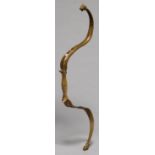 A MUGHAL INDIAN BRASS ARCHER'S BOW, CIRCA EARLY 19TH C, WITH CHISELLED ANIMAL HEAD TERMINALS,