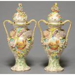 A PAIR OF STAFFORDSHIRE COALBROOKDALE FLORAL ENCRUSTED TWO HANDLED POT POURRI VASES AND COVERS,