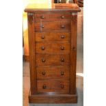 A VICTORIAN WALNUT WELLINGTON CHEST, C1880, WITH CARVED CORBELS, 103CM H; 35 X 51.5CM  A well