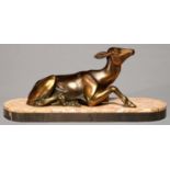 A FRENCH ART DECO BRONZED SPELTER SCULPTURE OF A RECUMBENT FAWN, ON MARBLE AND BELGE NOIR BASE,