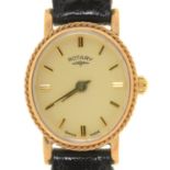 A ROTARY OVAL 9CT GOLD LADY'S WRISTWATCH, QUARTZ MOVEMENT, 20 X 17MM, ON A BLACK LEATHER STRAP