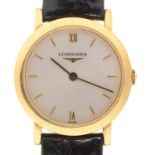 A LONGINES 18CT GOLD LADY'S WRISTWATCH, QUARTZ MOVEMENT, ON BLACK LEATHER STRAP, 24MM DIAM