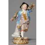 A MEISSEN FIGURE OF A YOUTH WITH A GARLAND, LATE 19TH C, IN BLACK HAT AND LIGHT BLUE COAT, WITH GILT