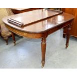 A VICTORIAN MAHOGANY DINING TABLE, C1890, THE TOP WITH D SHAPED ENDS ON FINELY REEDED INVERTED