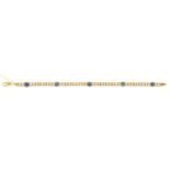 A GOLD CURB BRACELET SET WITH SAPPHIRES EN CABOCHON AT INTERVALS, 19.5CM L, MARKED 750, 12G Good