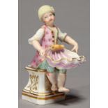 A MEISSEN FIGURE OF A BOY, MID 19TH C, SEATED ON A GILT PEDESTAL HOLDING A LARGE PINK SHELL ON HIS