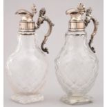 A PAIR OF WILLIAM IV SILVER MOUNTED CUT GLASS CRUET BOTTLES, WITH CARYATID HANDLE, THE DOMED COVER