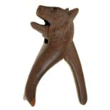A SWISS BLACK FOREST BEAR NOVELTY CARVED LIMEWOOD LEVER NUT CRACKER, EARLY 20TH C, 16CM H Chip one