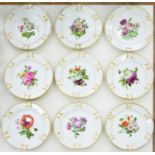 A SET OF TEN PARIS DECORATED PORCELAIN DESSERT PLATES, C1860, PAINTED IN 'WET' ENAMELS WITH MULTI