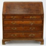 A GEORGE III OAK AND CROSSBANDED BUREAU, EARLY 19TH C, ON BRACKET FEET, 110CM H; 105CM X 50CM