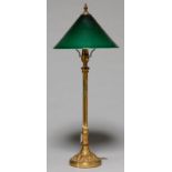 AN EDWARDIAN LACQUERED BRASS DESK LAMP, C1910, THE IRON WEIGHTED FOOT CAST WITH ACANTHUS LEAVES, THE