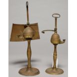 TWO SIMILAR NORTHERN EUROPEAN BRASS OIL LAMPS, EARLY 19TH C, WITH SHAPED HANDLE, ONE RETAINING