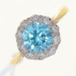 A BLUE ZIRCON AND DIAMOND CLUSTER RING, GOLD HOOP, INDISTINCTLY MARKED, 2.9G,   SIZE K Good