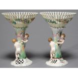 A PAIR OF GERMAN PORCELAIN FLORAL ENCRUSTED FRUIT STANDS, LATE 19TH C, THE CONICAL BASKET ON