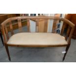 AN EDWARDIAN MAHOGANY AND LINE INLAID SETTEE WITH PADDED SEAT, ON SQUARE TAPERED LEGS, 114CM L