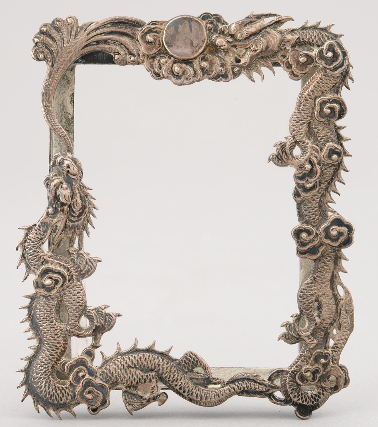 A CHINESE SILVER REPOUSSE DRAGON'S PHOTOGRAPH FRAME, C1900, 10 X 8CM, MARKED 90, W H AND IN CHINESE,