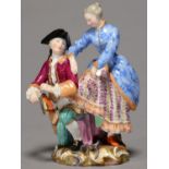 A MEISSEN GROUP OF WINTER, C1870, AS A GALLANT KNEELING BESIDE A LADY TO TIE HER SKATE, 13.5CM H,
