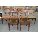 SIX VICTORIAN MAHOGANY BALLOON BACK DINING CHAIRS ON TURNED OR FLUTED LEGS None with loose joints;
