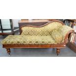 A VICTORIAN CARVED MAHOGANY CHAISE LONGUE, ON TURNED FEET AND POTTERY CASTORS, WITH BUTTONED CUSHION