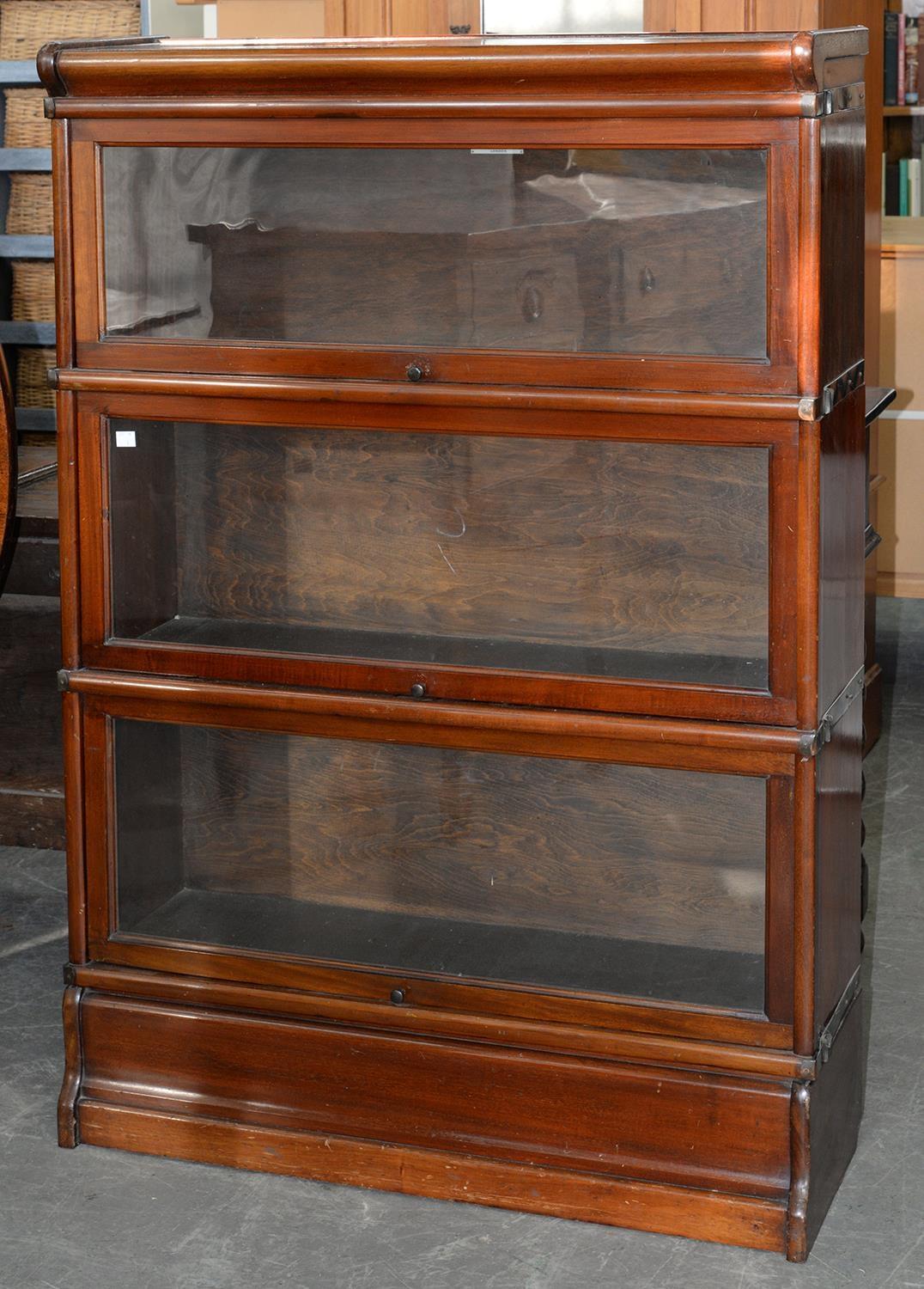 A GLOBE WERNICKE CO LIMITED MAHOGANY THREE TIER SECTIONAL BOOKCASE, EARLY 20TH C, MAKER'S IVORINE