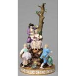 A MEISSEN GROUP OF GARDENERS, MID 19TH C, THE SIX FIGURES STANDING ON ROCKS OR AROUND THE ROCKY GILT