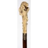 A EBONY WALKING CANE WITH A JAPANESE CARVED BONE BEAR AND SERPENT HANDLE, MEIJI PERIOD, ENGRAVED