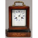 A FRENCH ROSEWOOD AND INLAID MANTEL CLOCK OF BALE SHAPE, C1860, WITH FOLIATE CAST BRASS LOOP HANDLE,