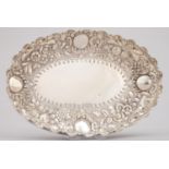 A VICTORIAN OVAL SILVER FRUIT DISH, DIE STAMPED AND CHASED WITH FLOWERS AND FOLIAGE ON A MATTED