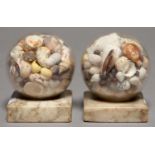 A PAIR OF SEASHELL-FILLED GLASS SPHERE ORNAMENTS, ON ALABASTER BASE, 20TH C, 8CM H Good condition