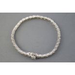 A white metal fancy line bracelet.