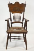 An oak armchair with bobbin turned legs and spindles,
