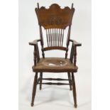 An oak armchair with bobbin turned legs and spindles,