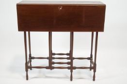 An Edwardian mahogany "spider leg" drop leaf table,