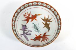 A Japanese porcelain bowl, painted in enamels with koi carp,