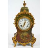 A Louis XVI style mantel clock, the brass mounted case painted with figures, after Watteau,