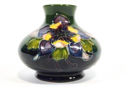 A small Moorcroft vase, of squat baluster form, decorated with the Columbine pattern,