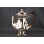 A silver plated coffee pot with fruit wood handle,