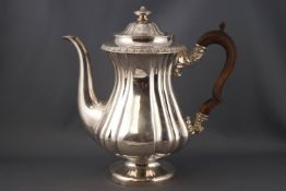 A silver plated coffee pot with fruit wood handle,