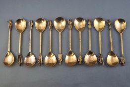 A cased set of twelve silver gilt Apostle type tea spoons, the Tichborne spoons,