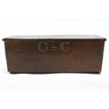 A 17th century oak plank coffer, with later brass stud decoration,