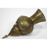 A Middle Eastern brass Islamic Mosque lamp, heavily pierced and engraved with decorative strap work,