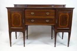 An Edwardian mahogany sideboard, with inverted breakfront,