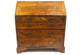 A George III elm bureau, with fall front above four graduated long drawers on bracket feet,