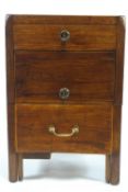 A George III mahogany commode with three drawers on square legs,