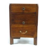 A George III mahogany commode with three drawers on square legs,